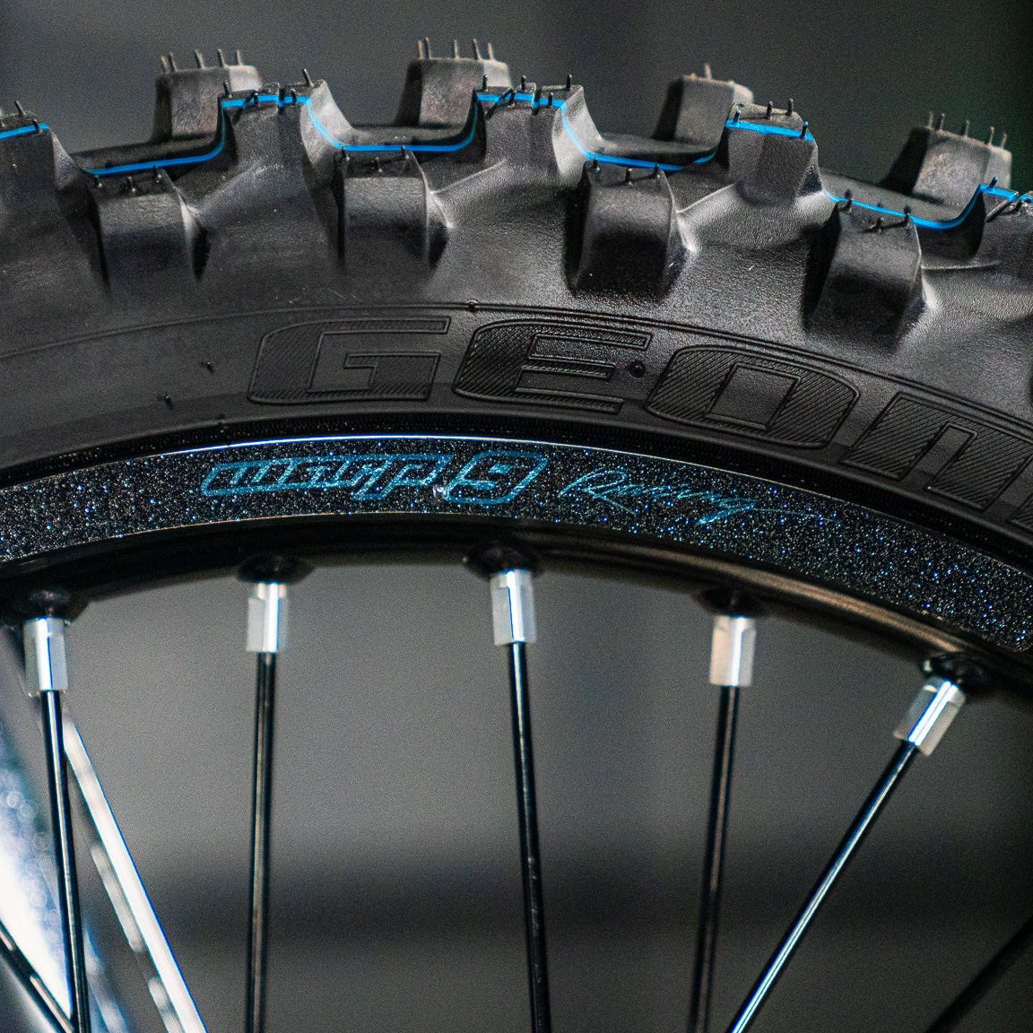 Warp 9 rim decals installed on motocross wheel