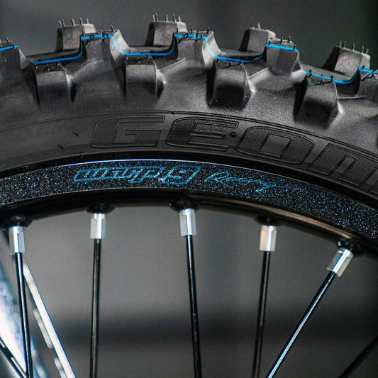 Warp 9 rim decals installed on motocross wheel