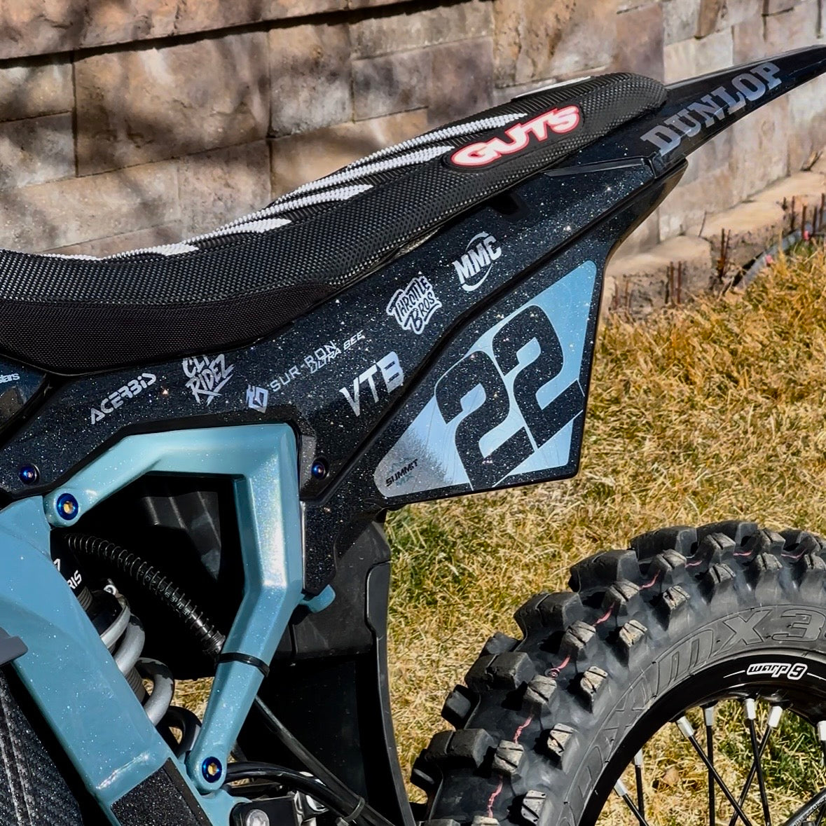 Installed on blue Surron Ultra Bee e-moto fenders