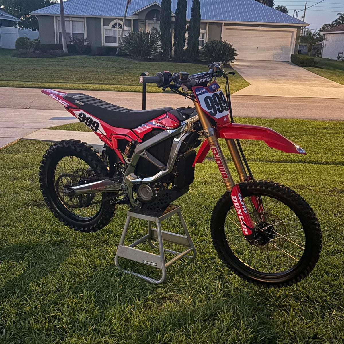 Installed on red Surron Ultra Bee e-moto