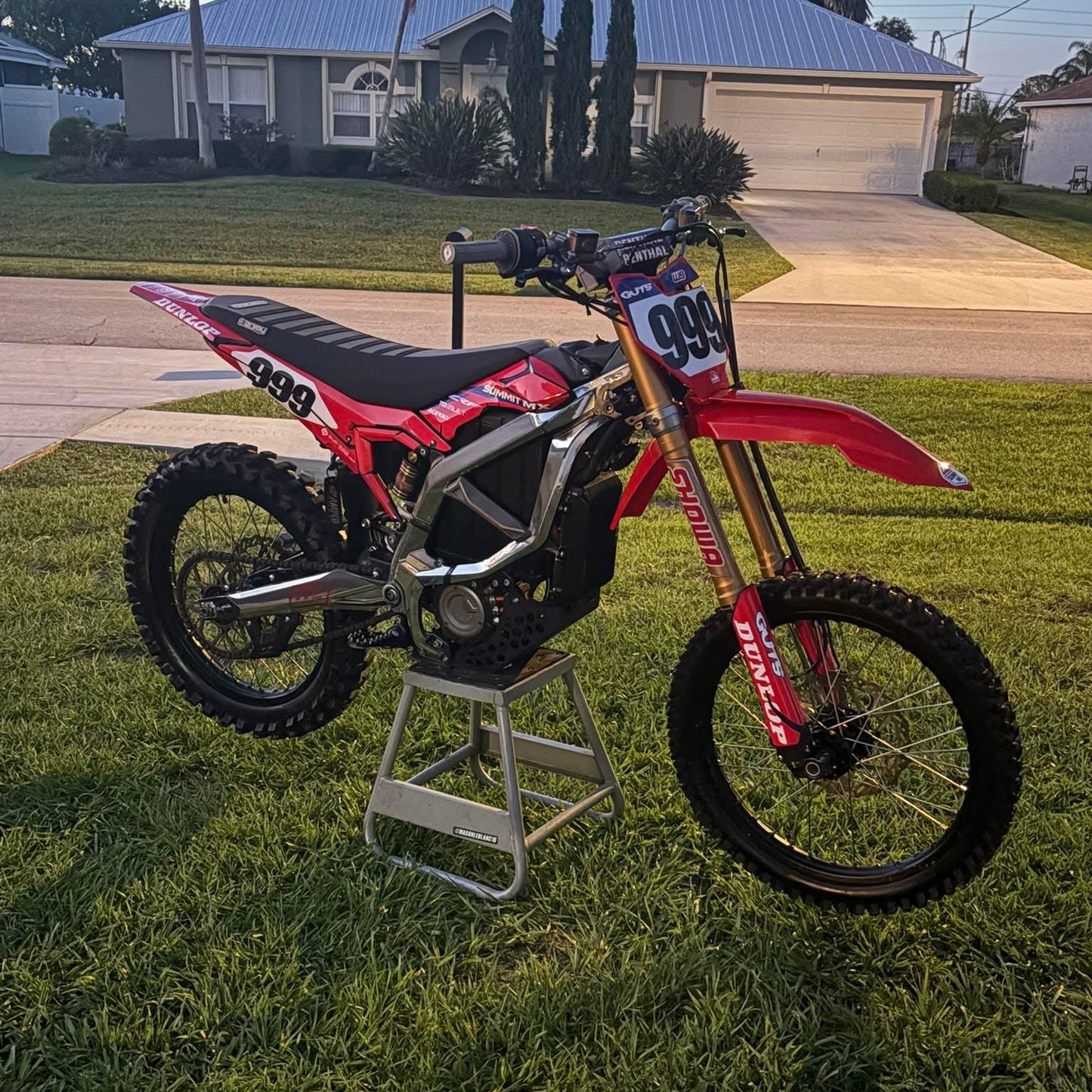 Installed on red Surron Ultra Bee e-moto