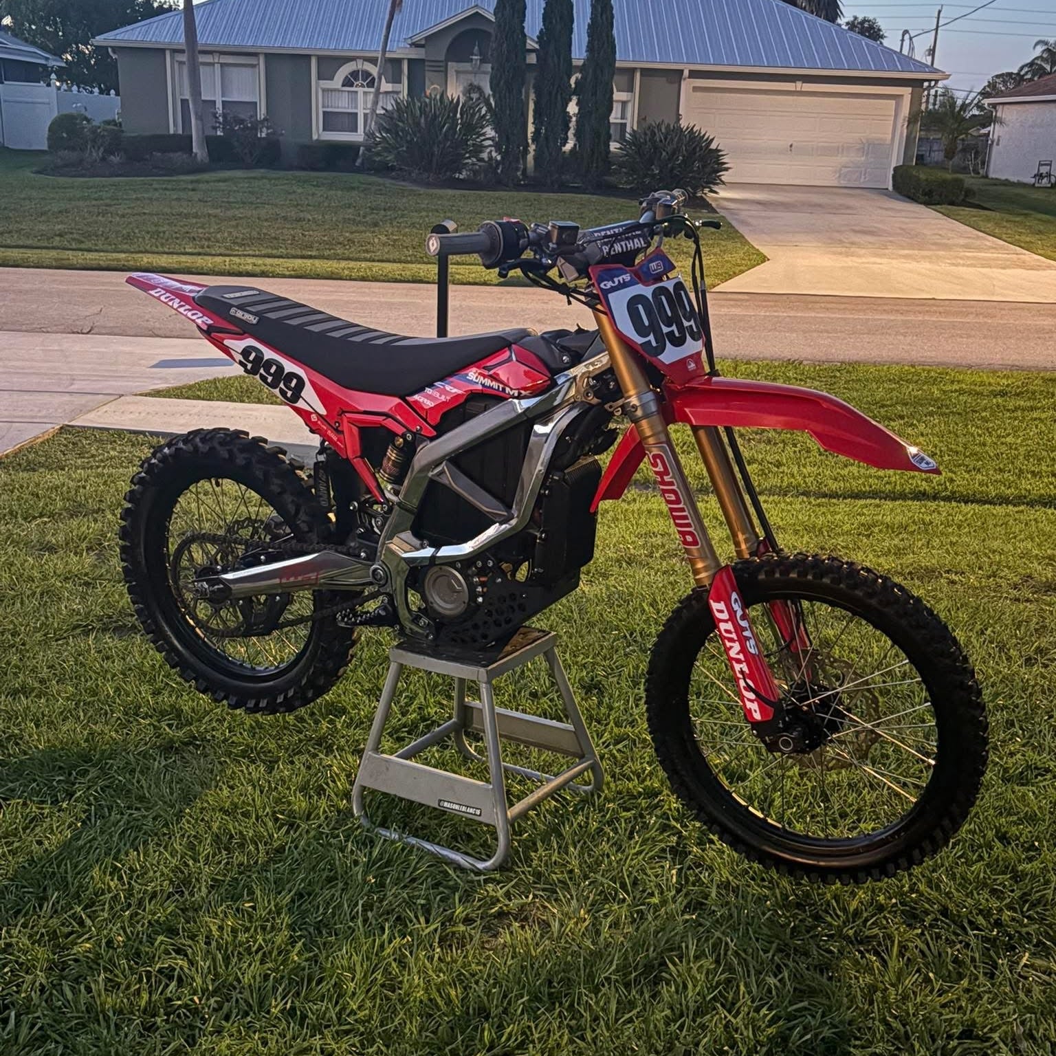 Installed on red Surron Ultra Bee e-moto